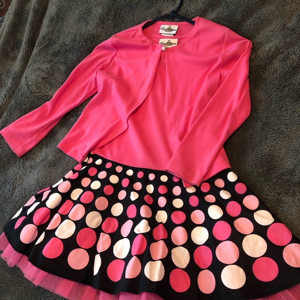 A kids sleeveless dress with a cardigan